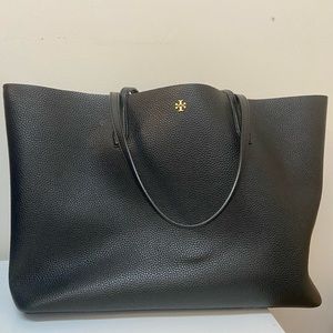 Gently used Tory Burch tote in black . Only used 6-7 times.